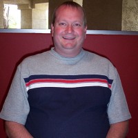 Gary Rayburn Smiling man with thinning hair